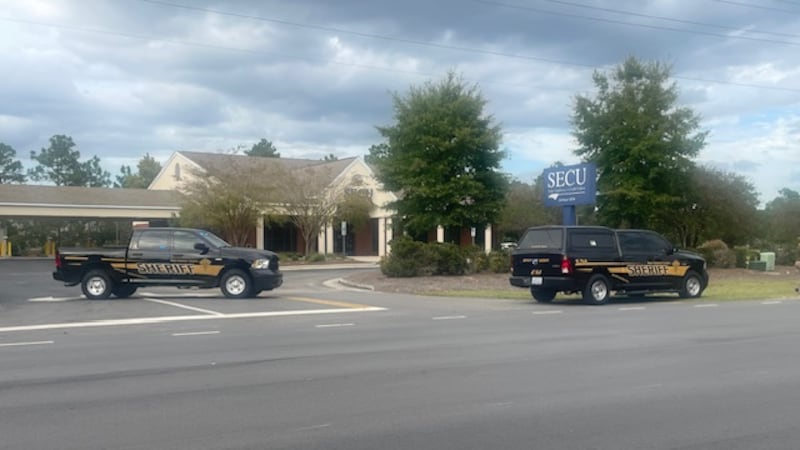 Police outside SECU on Sanders Road in Wilmington.