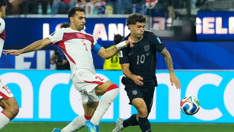 United States' Christian Pulisic (10) and Turkey's Zeki Celik battle for the ball during the...