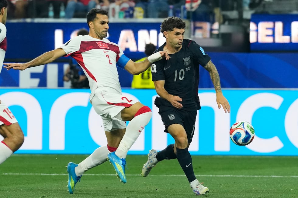 United States' Christian Pulisic (10) and Turkey's Zeki Celik battle for the ball during the...