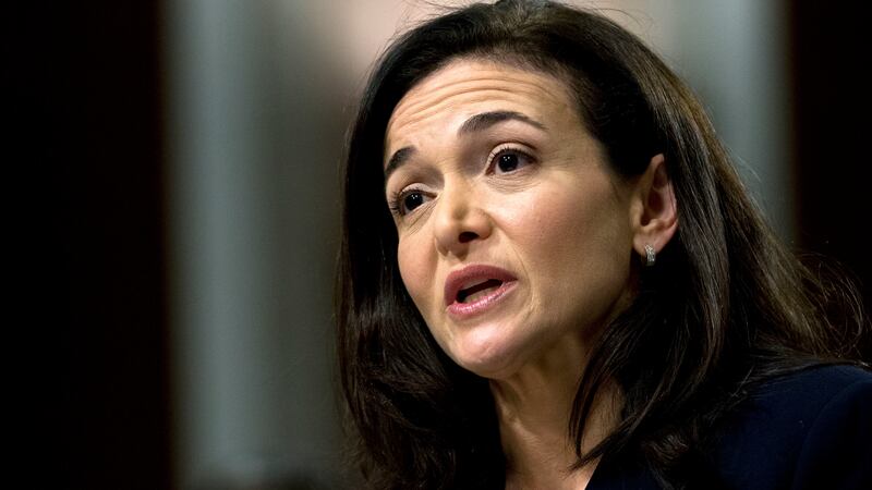 FILE - Facebook COO Sheryl Sandberg testifies before the Senate Intelligence Committee hearing...