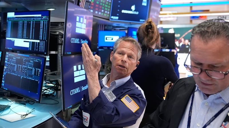 Bobby Charmak works on the floor at the New York Stock Exchange in New York, Tuesday, April 7,...