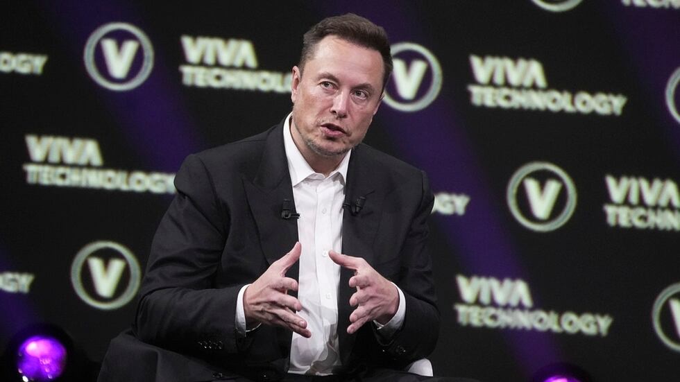 FILE - Elon Musk, who owns Twitter, Tesla and SpaceX, speaks at the Vivatech fair Friday, June...