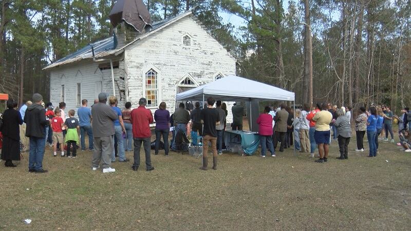 Volunteers gather to Reaves Chapel in Navassa to restore it to become a community building