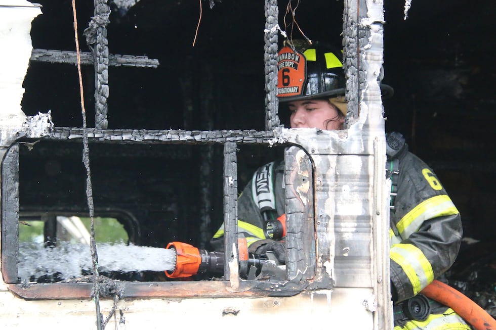 Winnabow firefighters battle large camper fire