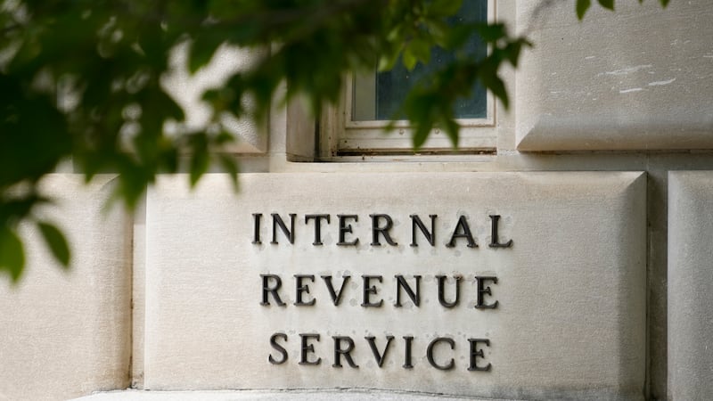 FILE - A sign outside the Internal Revenue Service building is photographed May 4, 2021, in...