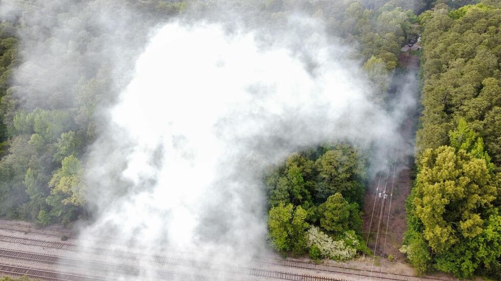 Firefighters arrived to find “heavy smoke” coming from a wooded area that they said was...