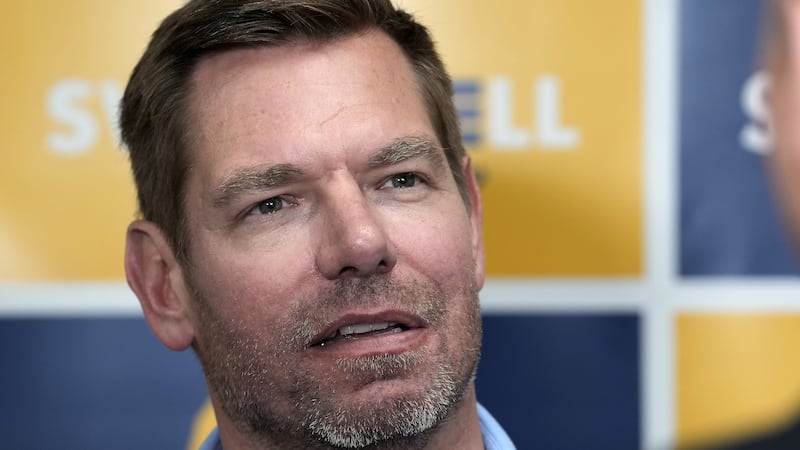 FYI - Rep. Eric Swalwell, D-Calif., talks with reporters after holding a town hall meeting in...